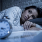 Ilustrasi seseorang mengalami gangguan tidur (insomnia).