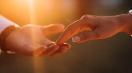 Newlyweds hands affectionate touch each other